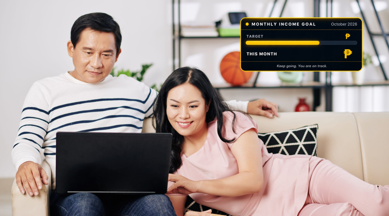 Freelancer couple in their 40s checking freelancing income goal tracker together on laptop